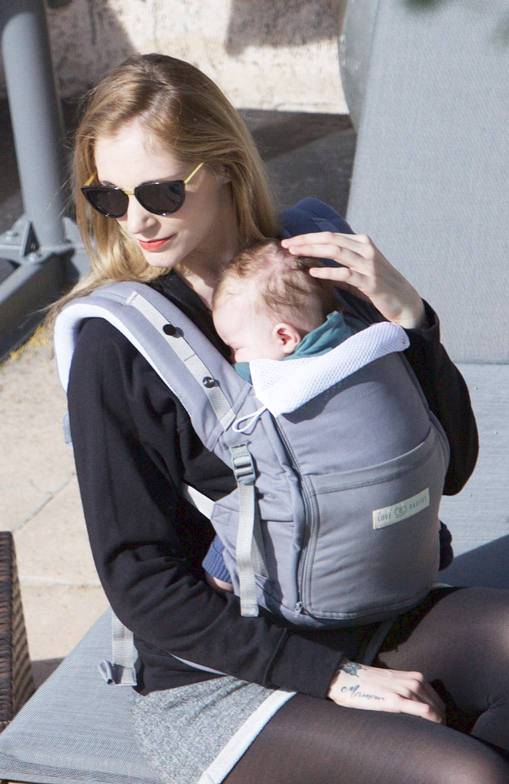 Best baby carrier the PhysioCarrier in grey Love Radius, mum babywearing his child